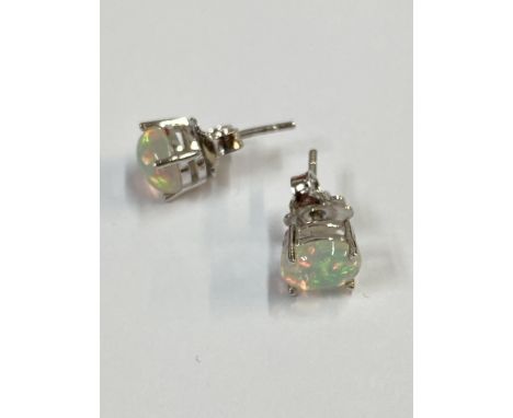 Pair of silver studs with white Ethiopian opal