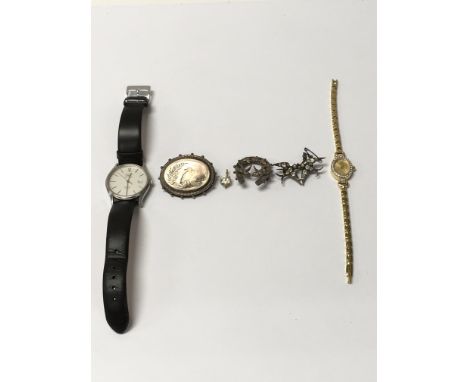 A collection of jewellery items: one men's rotary watch, one enamel brooch, one gold pendant, two silver brooches and a 23ct 