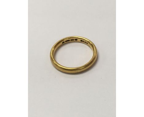 A 22ct gold wedding ring weighing approximately 4.5g and measuring approximately size m.