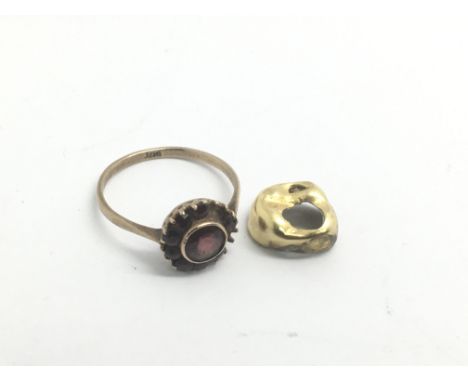 A gold ring, stones missing, and a gold tooth (2), approx 2.7g.