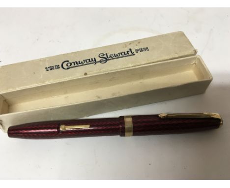 A vintage red coloured case Conway Stewart fountain pen. 
