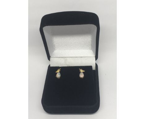 A pair of 9ct gold and opal earrings.