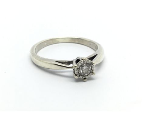 An 18carat white gold solitaire diamond ring the diamond approximately 0.15 of a carat. ring size N.