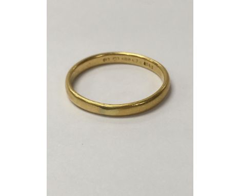 A 22ct gold wedding ring weighing approximately 3.2g and approximately between ring sizes q - r.