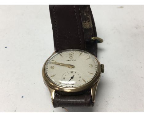 A vintage Omega wrist watch with second subsidiary dial and applied leather strap .