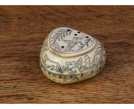 A scrimshaw horn heart shaped snuff box, engraved overall with a hunting scene, 4cm wide 