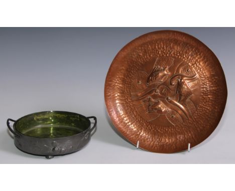 A Newlyn Arts and Crafts copper circular dish, repousse chased with with fish, within a broad planished border, 27cm diam, st