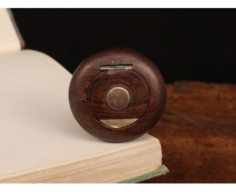 A 19th century turned rosewood bun shaped snuff box, the hinged cover set with a rose gold coloured metal roundel, 6cm diam, 