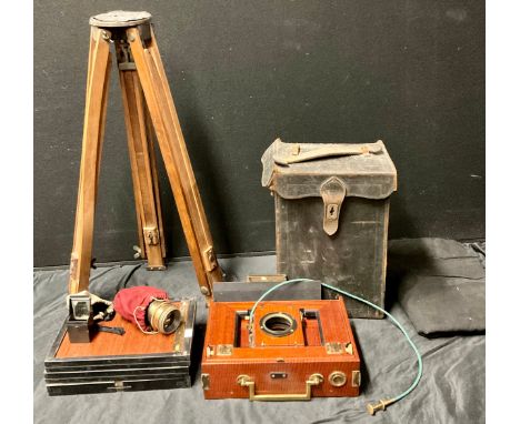 Photography - an early 20th century mahogany plate camera, 24cm high, cased, accessories and tripod en suite 