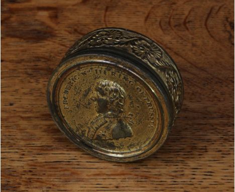 European Royalty and the Napoleonic Wars - a 19th century gilt metal circular snuff box, the screw-fitting cover embossed wit