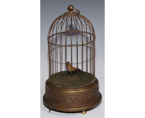 A brass clockwork novelty automaton, as a singing bird in a cage, suspension loop, 29cm high, 20th century 