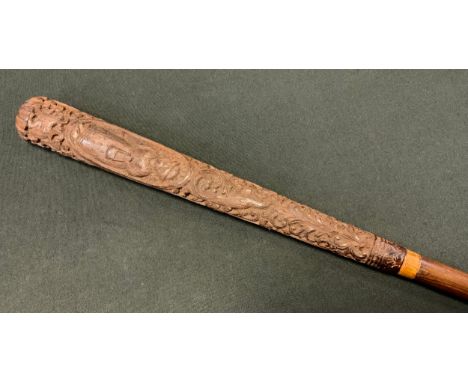 A Victorian Folk Art walking stick, the handle carved with figures, rabbits and birds, 100cm long, c.1890 