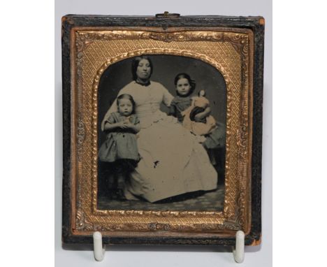 Photography - Toy and Juvenalia Interest - a 19th century ambrotype photograph, of a mother and children, the eldest holding 