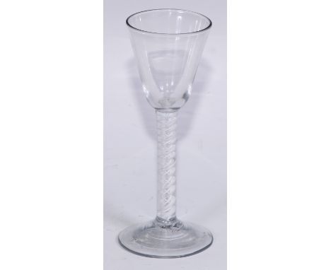 A George III opaque twist wine glass, conical bowl, double-helix stem, domed foot, 15cm high, c.1765 