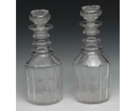 A pair of 19th century mallet shaped clear glass decanters, triple ring neck, globular and star cut stoppers, 26cm high, c.18