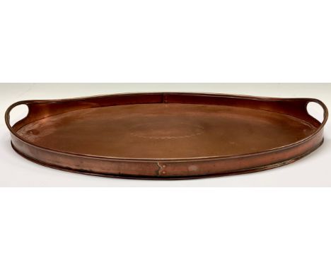 An Arts and Crafts Newlyn copper two handled oval tray 