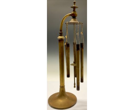 A set of early 20th century brass table chimes, swan neck stand, spreading circular base, 43cm high 