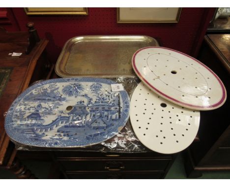 Three ceramic drainage trays including blue and white pogoda scene and a silver plated serving tray