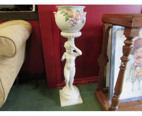 A modern Continental white glazed ceramic jardiniere on figural stand, 78cm