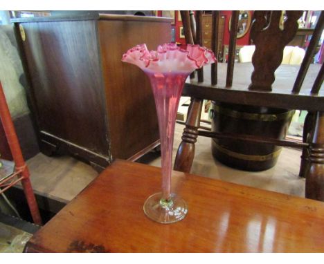 A tall Victorian cranberry/vaseline glass trumpet vase, 31cm tall