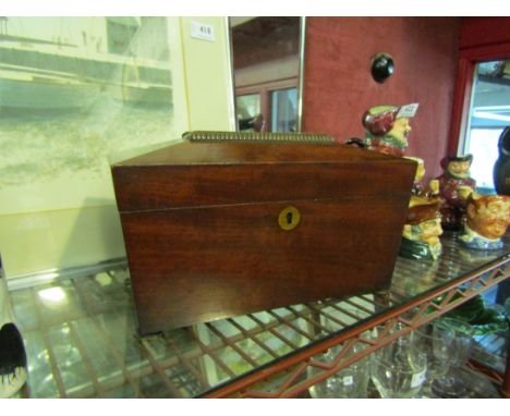 A sarcophagus shaped tea caddy on bun feet for restoration