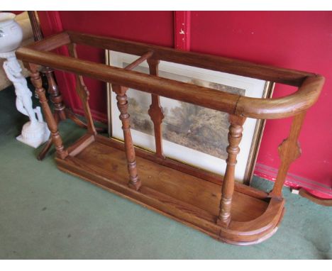 A 19th Century country house pitch pine large stick stand on turned supports, 123cm x 73cm x 29cm
