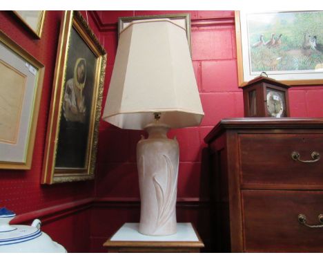 A terracotta Art Nouveau style urn shaped table lamp base with cream shade