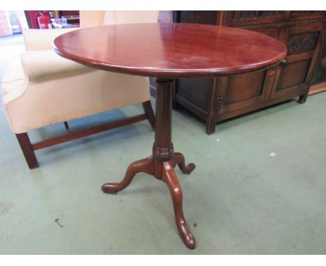 A 19th Century mahogany and oak circular tilt top wine table on cannon barrel turned column and tripod base, 70cm tall x 68cm