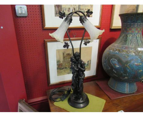 A figural table lamp with twin tulip sconces, 64cm tall
