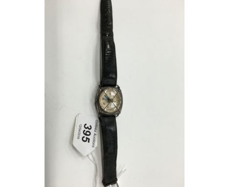 A WWII silver cased compass wristwatch (af).