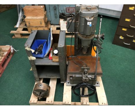 A bench drilling machine made by Multico, Model No. K1, Serial No. 2738, driven by a Hoover AC motor, resting on a cast iron 