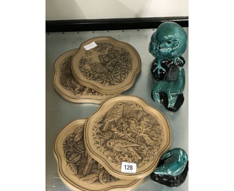A set of four Poole Pottery Barbara Linley Adams Four Seasons plaques together with a blue glazed model of a Little Owl and t