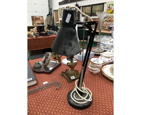 An Industrial black painted anglepoise style desk lamp. 