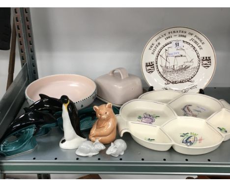 A small quantity of various Poole Pottery items including an hors d'oeuvre dish, dolphins, bear and mice.