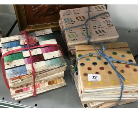A quantity of various Poole Pottery tile colourway samples.