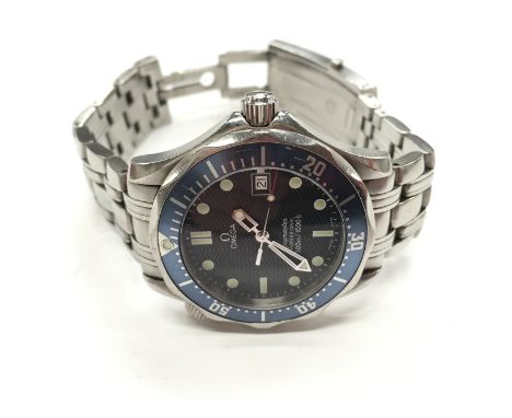 A gentleman's stainless steel cased Omega Seamaster professional wristwatch, dark blue wavy dial, circular baton numerals wit