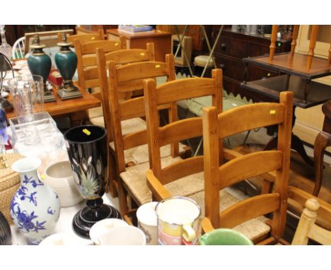 A set of six cherry wood ladder back and rush seated chairs 