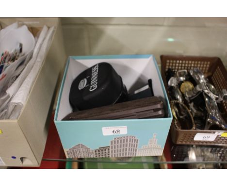 A box containing various wrist watches and a gold plated Dunhill lighter, ball point and fountain pens etc. 
