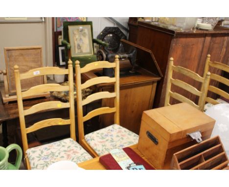 A set of four pine ladder back kitchen chairs 
