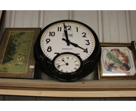 A large modern wall clock; and a Laura Ashley wall clock