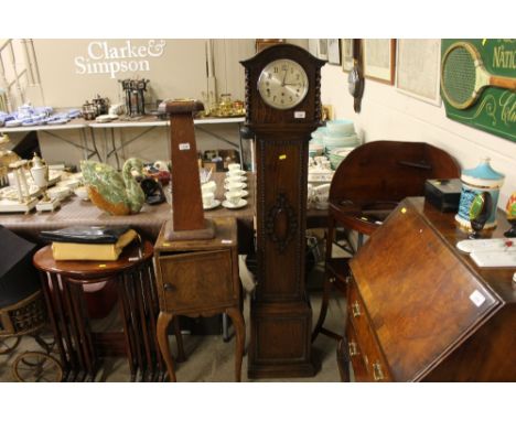 A 1930's oak grandmother clock
