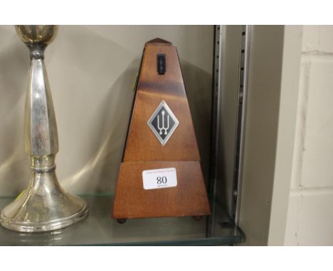 A wooden cased metronome 