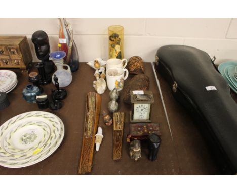 A brass cased carriage clock  AF; two commemorative mugs; two fans; an ebony elephant etc. 