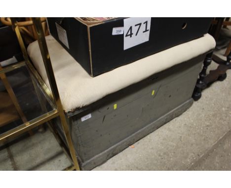 A pine trunk with upholstered seat
