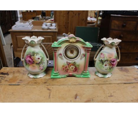 An Edwardian china clock garniture