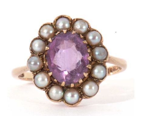 Vintage amethyst and seed pearl cluster ring, the oval faceted amethyst 10 x 6mm, multi-claw set within a small seed pearl su