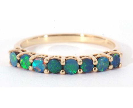 Modern 9ct gold opal doublet 8-stone ring, featuring 8 small opal doublets, line set in a pierced gallery, size R