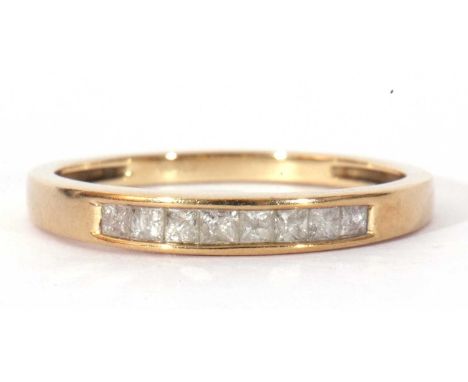 Modern 9ct gold and diamond ring featuring eight small Princess cut diamonds, channel set, size R