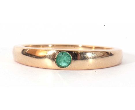 Modern 9ct gold single stone emerald ring, the plain polished band centring a flush set small round emerald, size R