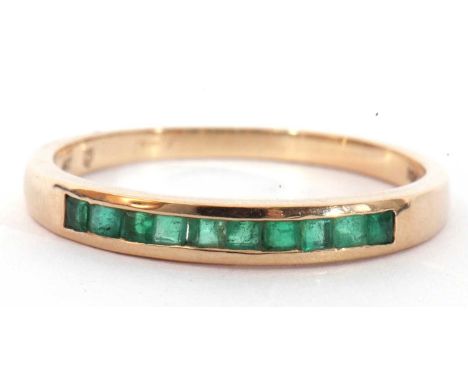 Modern 9ct gold and emerald ring featuring 10 calibre cut square emeralds, channel set, size R